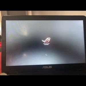 ASUS gaming laptop with mouse and protective case